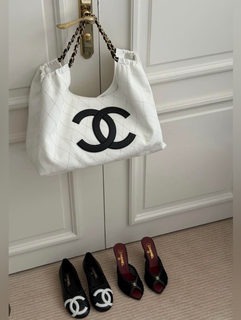 Like New CHANEL White Quilted Shoulder Bag with Black CC Emblem